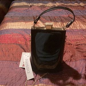 Black patent pleather purse with gold and rhinestone details